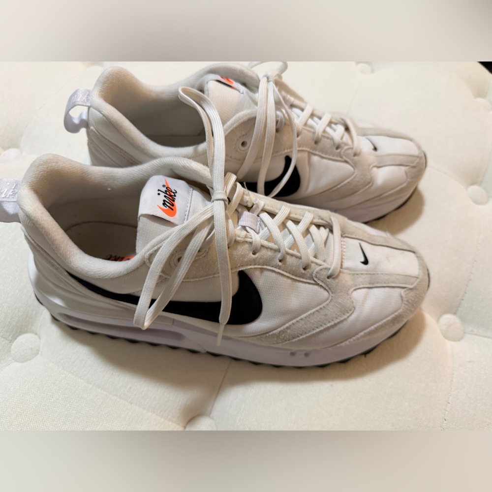 Nike womens White Sneakers with Black Swoosh and Orange Accent